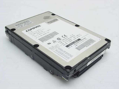 Fujitsu MAB3045SC 4.3GB 80-Pin SCSI hard drive top view with Compaq label and WARNING sticker