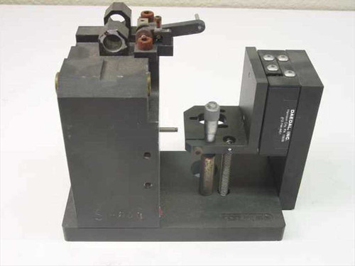 Daedal linear slide custom inspection assembly – rear-right three-quarter view showing Daedal label on slide block, threaded lead screw, and clamping fixture detail