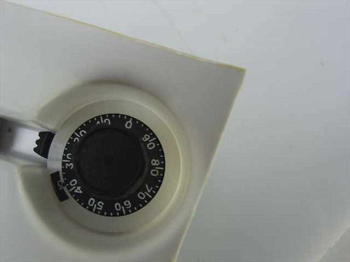 Close-up of a single Dial Electronics H507-6A rotary dial counter showing numbered dial face with graduated 0–100 scale markings and actuator arm