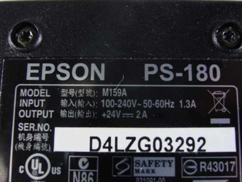 Epson PS-180 M159A label showing model, input 100-240V 50-60Hz 1.3A, output +24V 2A, serial number, and UL/safety certifications