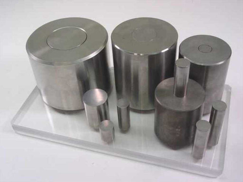 South Bay Technology sectioning saw die set lot — full group of multiple cylindrical steel dies and punches displayed on clear acrylic tray