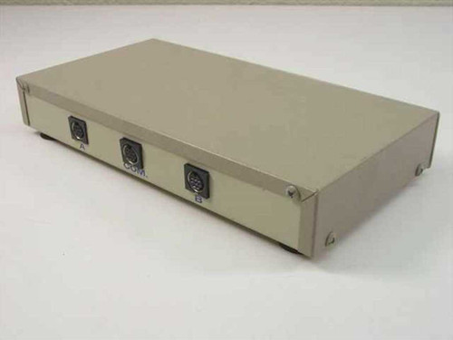 Data Spec DSM802 data switch box — rear panel showing three Mini-DIN connectors labeled A, COM, and B