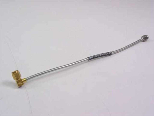 Harbour Industries 200086-014 7-inch microwave SMA cable full view showing flexible stainless-jacketed body with part number label and both SMA connectors