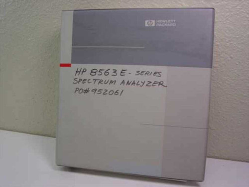 HP 8560 E-Series Spectrum Analyzer User's Guide binder — front cover with Hewlett-Packard logo and handwritten label reading HP 8563E Spectrum Analyzer