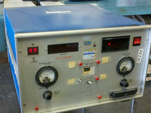 DT1448 custom DC power test bench front panel overview showing dual Simpson microammeters, LED test number display, Analogic DVM, and red indicator buttons