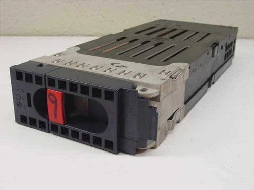 IBM 88G8199 SSA hard drive caddy front view showing black plastic housing and locking handle with red label marked '9'