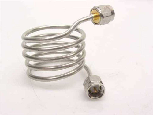 Stainless steel coiled coaxial cable SMA male to SMA female – side profile view showing coil form and both connectors extended