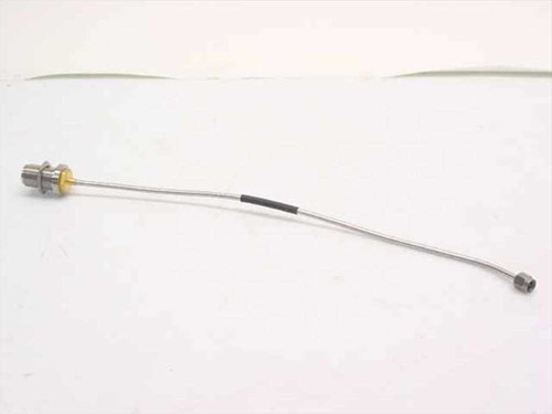 Semi-rigid coaxial cable approximately 11 inches long with N-Female bulkhead connector at left end and SMA-Male connector at right end – full length side view