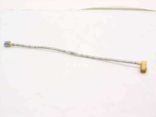 Semi-rigid coaxial RF jumper cable full view — SMA male straight connector on left, SMA male right angle connector on right, approximately 7–9 inches long