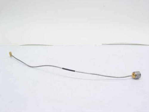 Semi-rigid coaxial cable full length view showing angled SMA male connector at left end and N-type female bulkhead connector at right end