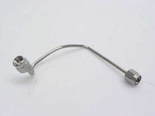 Preformed rigid coaxial cable 202543-002 with SMA-male connectors on both ends, full side view showing curved shape and mounting tab
