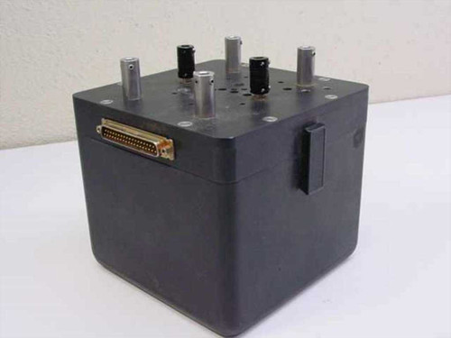 BEI 01238/30-710460-001 C-Band Satcom Channel Changer – front-left view showing D-sub multi-pin connector on front face and four shaft posts on top