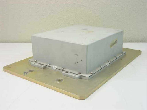 Avantek PS-110-004 outdoor power supply rear-right view showing sealed gray metal enclosure and gold-anodized aluminum baseplate with mounting hardware