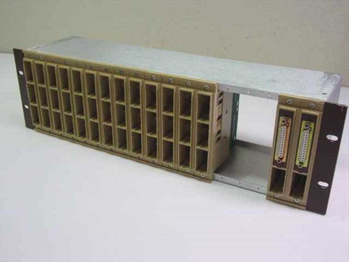 Dynatech RA-1 mounting frame front view showing empty card slots and one installed Dyna-Patch Mark II card on right side