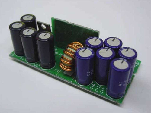 IBM 01K7371 VRM — reverse side view showing large electrolytic capacitors and toroidal inductor coil on green PCB