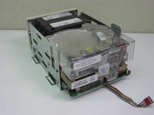 Quantum TH6AA DLT 7000 tape drive – top and left side view showing clear top cover, PCB, and attached rainbow ribbon cable