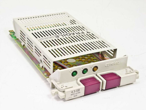 Compaq 242801-001 hot-plug Wide Ultra SCSI hard drive caddy — front three-quarter view with drive installed and LED indicators visible