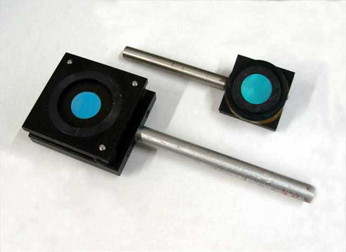 Oriel coated optical mirror anti-vibration mounts — both mounts side by side showing blue-coated mirrors and metal stems