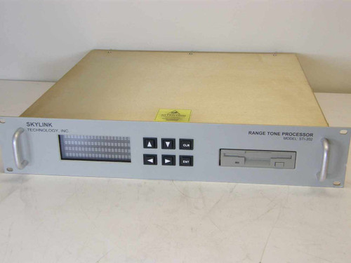 Skylink Technology STI-202 Range Tone Processor – full front panel view showing dot-matrix display, arrow/CLR/ENT buttons, floppy drive, and rack handles
