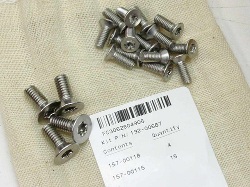 Hardware kit FC3062604905 label showing part number 192-00687, contents 157-00118 qty 4 and 157-00115 qty 15, with Torx fasteners laid out on burlap bag
