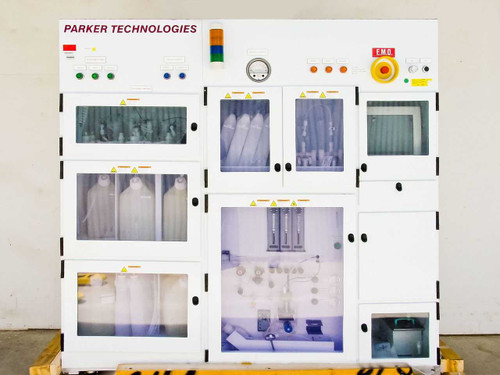 Parker Technologies PS2000 Gap Etch Metrology System – full front view of white freestanding cabinet with multiple compartment doors, status light tower, and E.M.O. stop button on top panel