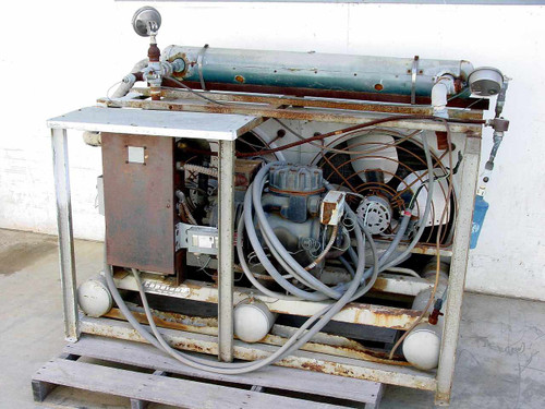 Copeland C2AH0750IFC001 hermetic condensing unit full left-side view on pallet showing compressor, fan motors, and horizontal condenser vessel