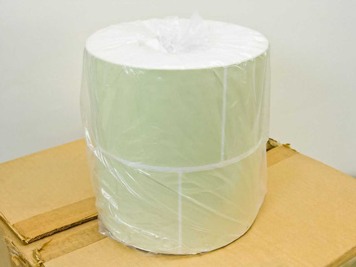 Intermec 050469 thermal label roll — single large roll in plastic wrap sitting on top of shipping box