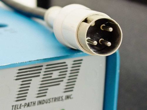 Close-up of Tele-Path Industries Inc. logo label and multi-pin DIN power connector on top of TPI 108-DS1 module