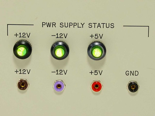 SSEL Command Generator front panel PWR SUPPLY STATUS section showing +12V, -12V, +5V indicator lights and banana jack test points all illuminated green