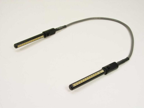 Dynatech Communications DPC-12-1 pogo pin patch cable full length view showing both cylindrical connectors and gray cable