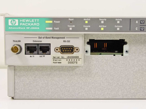 HP J2602A AdvanceStack left-side panel detail showing ThinLAN BNC port, Extension RJ-45 in/out, RS-232 DB-9 out-of-band management port, station address label, and LED indicators