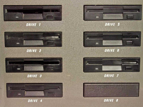 Cubix LCS Resource SubSystem close-up of all 8 TEAC FD-235HF 3.5-inch floppy drive bays labeled Drive 1 through Drive 8