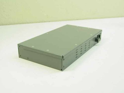 Andrew TRR 8120RJ modem – top and rear view showing vented gray metal enclosure and power cable