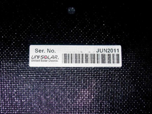Uni-Solar PVL-144 label closeup showing United Solar Ovonic brand name, barcode, and JUN2011 manufacture date