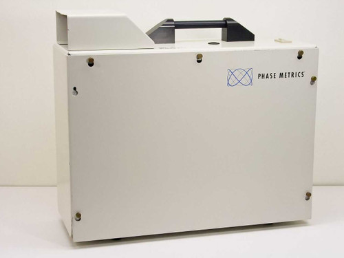 Phase Metrics Lamphouse 038050101 arc lamp source — right-side exterior view showing Phase Metrics logo on white enclosure with carry handle