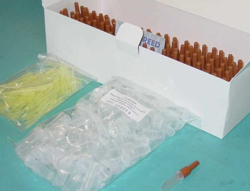 Alpharma Optibreed SQA III Chicken Progeny Test Kit 460101 — open box showing sample collection tubes, yellow pipette tips, and clear plastic vials for 100 tests