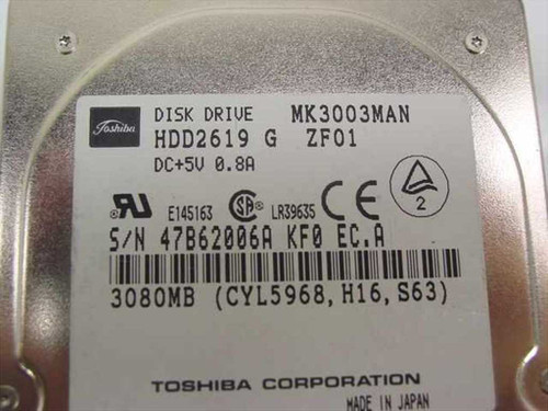 Toshiba MK3003MAN HDD2619 label close-up showing model, capacity, voltage, and serial number
