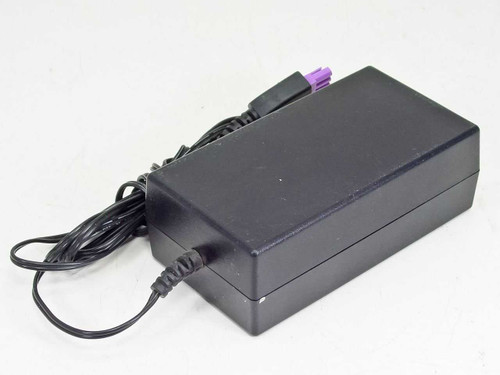 HP 0950-4476 printer power adapter — side and rear three-quarter view showing IEC C14 AC input end and cable routing