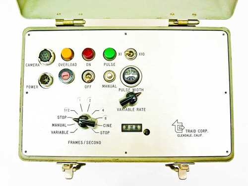 Traid Corp intervalometer controller front panel detail — frames per second dial, variable rate knob, pulse width knob, ON/OFF/MANUAL switches, and Overload/ON/Pulse indicator lights