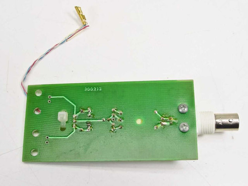 Guzik C-201 300210 Head Calibrator PCB reverse side showing solder traces, component pads, part number 300213 printed on board, BNC connector, and attached multi-wire harness