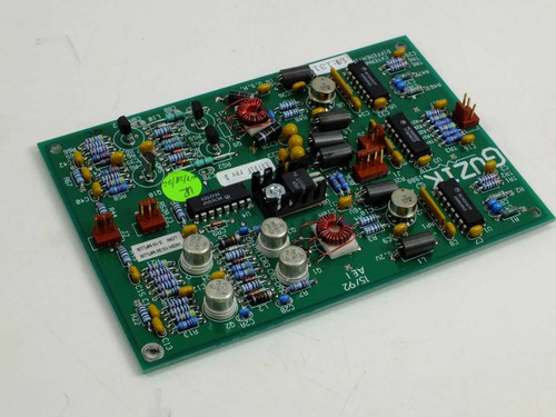 Guzik 300663 AEI circuit board angled top view showing reverse side orientation with green sticker and component layout