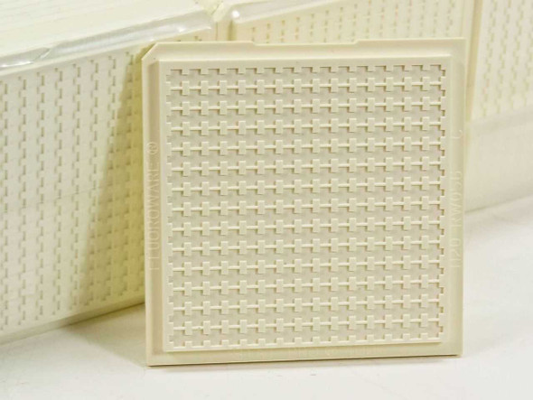 Fluoroware H20-RW056 Stat Pro 400 wafer carrier tray bottom – close-up of top surface showing 210-slot grid pattern with raised cross ribs