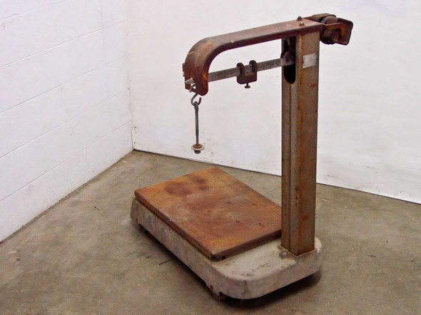 Fairbanks 41-3132 platform scale – left-side three-quarter view showing beam balance arm, hanging hook, and wood-topped steel platform