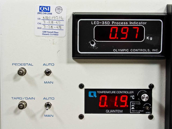 Research Devices M9 rework station controller console – close-up of Olympic Controls LED-35D process indicator reading 0.97 Kg and Quantem Temperature Controller reading 0.19°C, with PEDESTAL and TARG/GAIN AUTO/MAN toggle switches; QSI calibration label visible