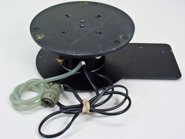 Harris/Farinon 1107 heated wafer chuck — top/rear view showing underside of 2.25-inch vacuum plate with mounting screw holes, brass side fitting, and pneumatic tubing loop