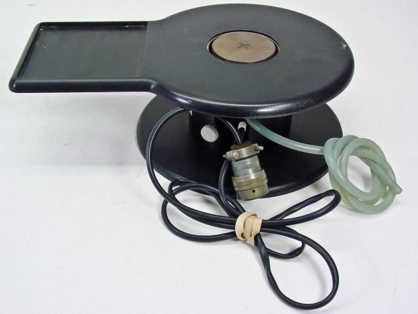 Harris/Farinon 1107 heated wafer chuck — front 3/4 view showing 2.25-inch circular vacuum plate, rectangular tray extension, black body, multi-pin mil-spec connector, and clear pneumatic tubing
