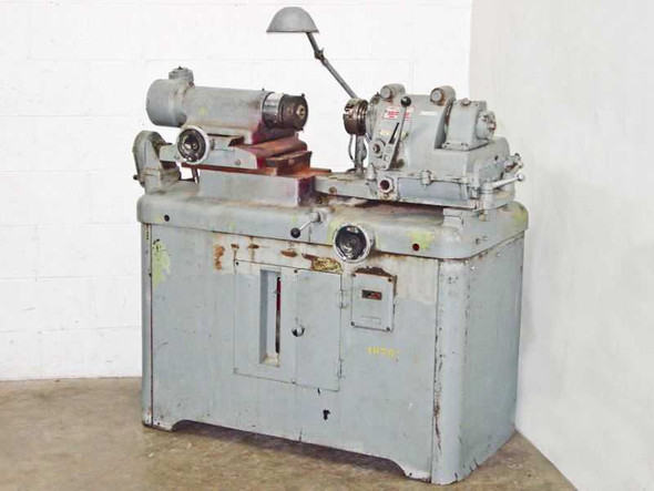 Autoflow Engineering 3173 lens polishing lathe — front-right three-quarter view showing overall machine profile and cabinet