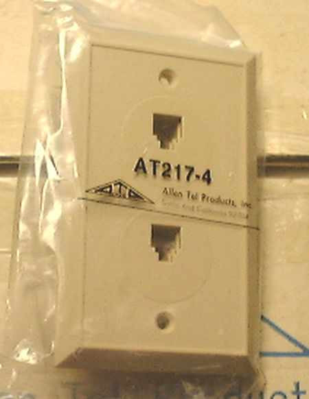 Allen Tel Products AT217-4 dual telephone wall jack front view, white single-gang plate with two RJ11 ports, new in poly bag
