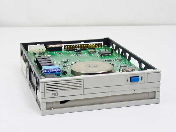 Iomega Beta 90B SCSI optical drive – angled top view showing PCB, spindle motor, and front bezel with '90' label