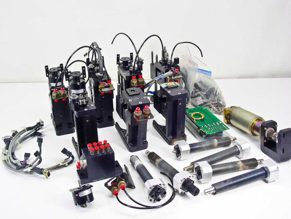 Second overview angle of complete SMC pneumatic parts lot showing actuator assemblies, linear guide cylinders, Pittman motor and loose components